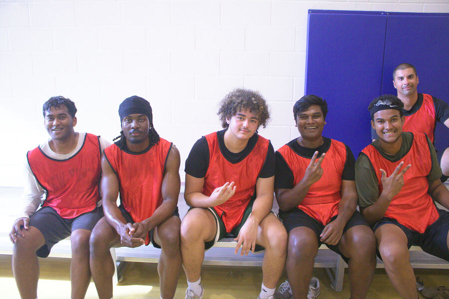 The red team on the bench, smiling